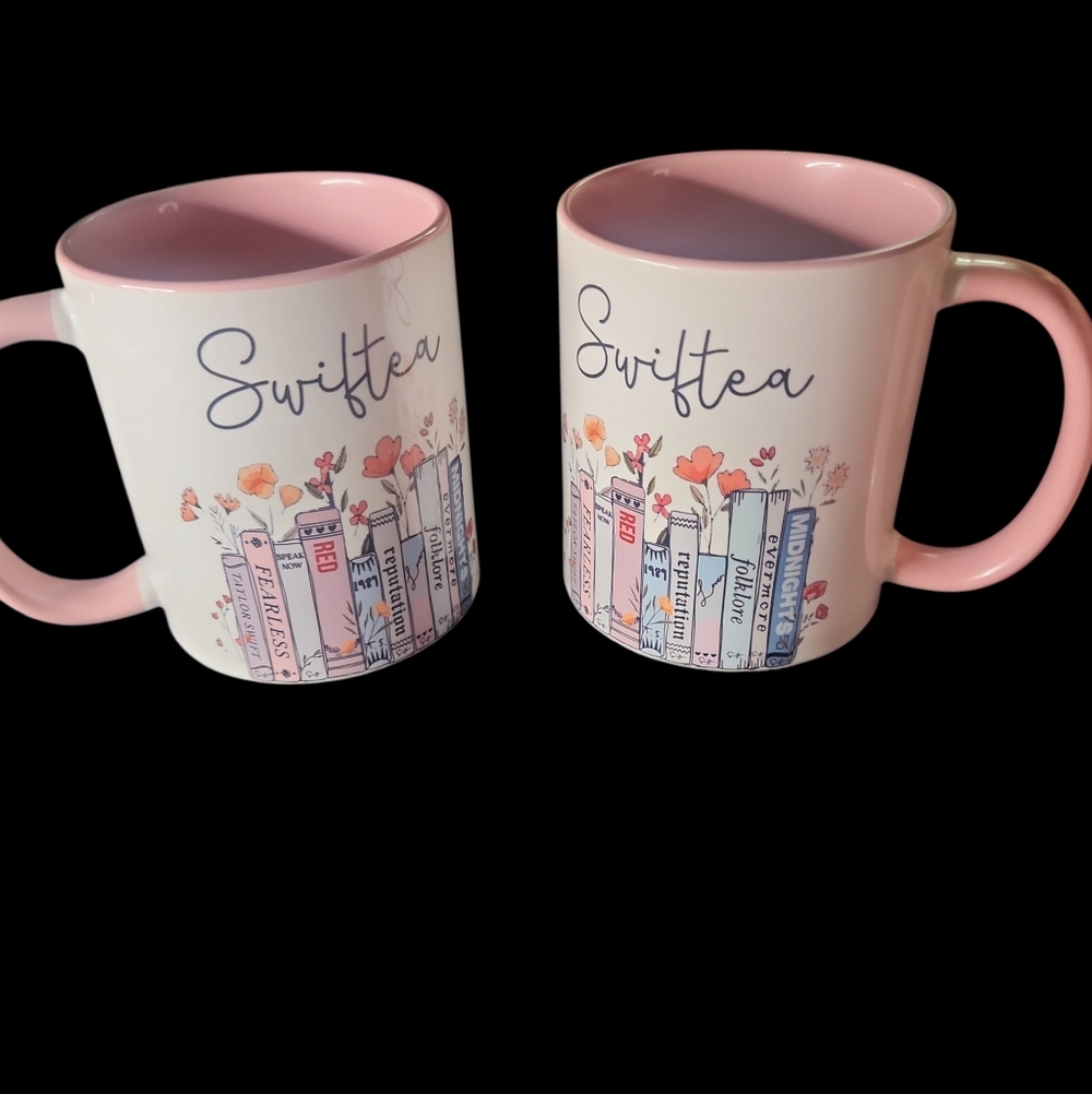 2 CERAMIC SWIFTEA MUGS. NEVER USED NEW WITHOUT TAGS . BOOKS ARE ALBUM NAMES - Picture 1 of 4